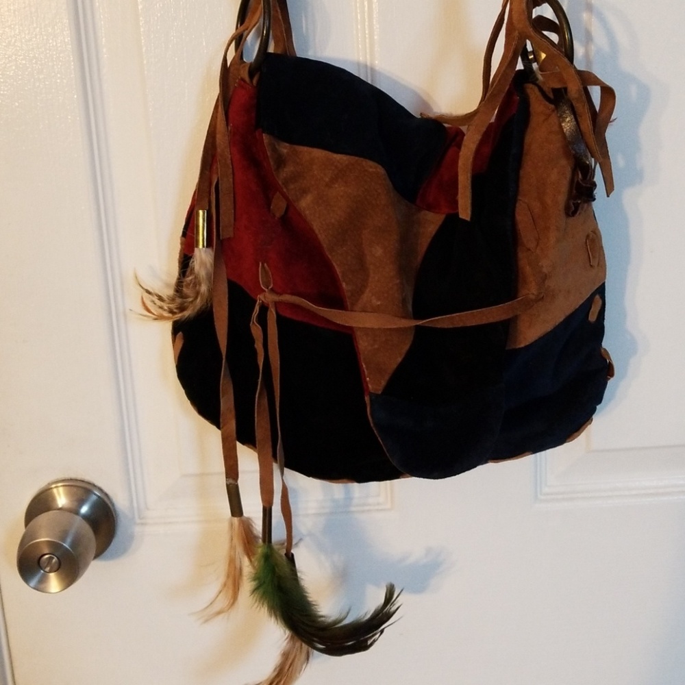 Suede Patchwork purse with feather accents